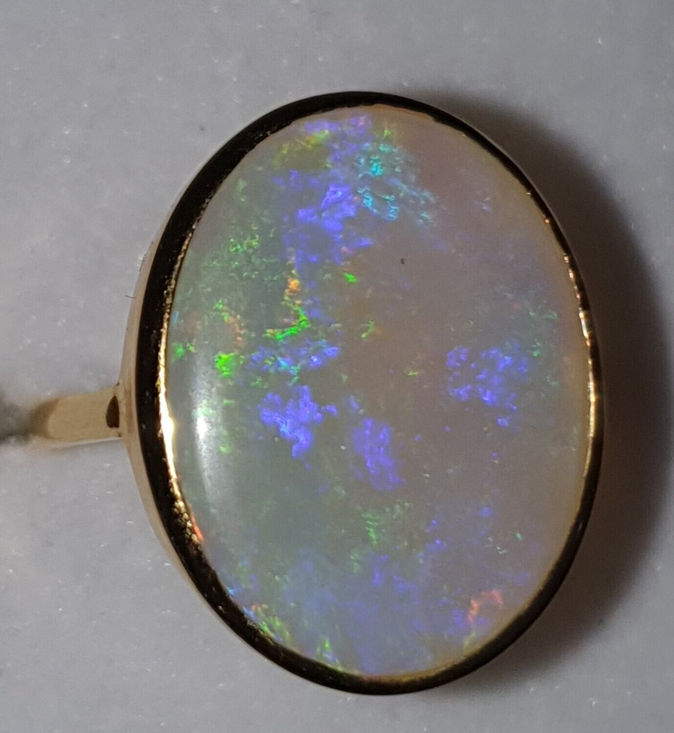 R16  Oval Cabochon Crystal Solid Opal Ring With Predominant Purple & Green, Semi Translucent, Set in 9ct Yellow Gold