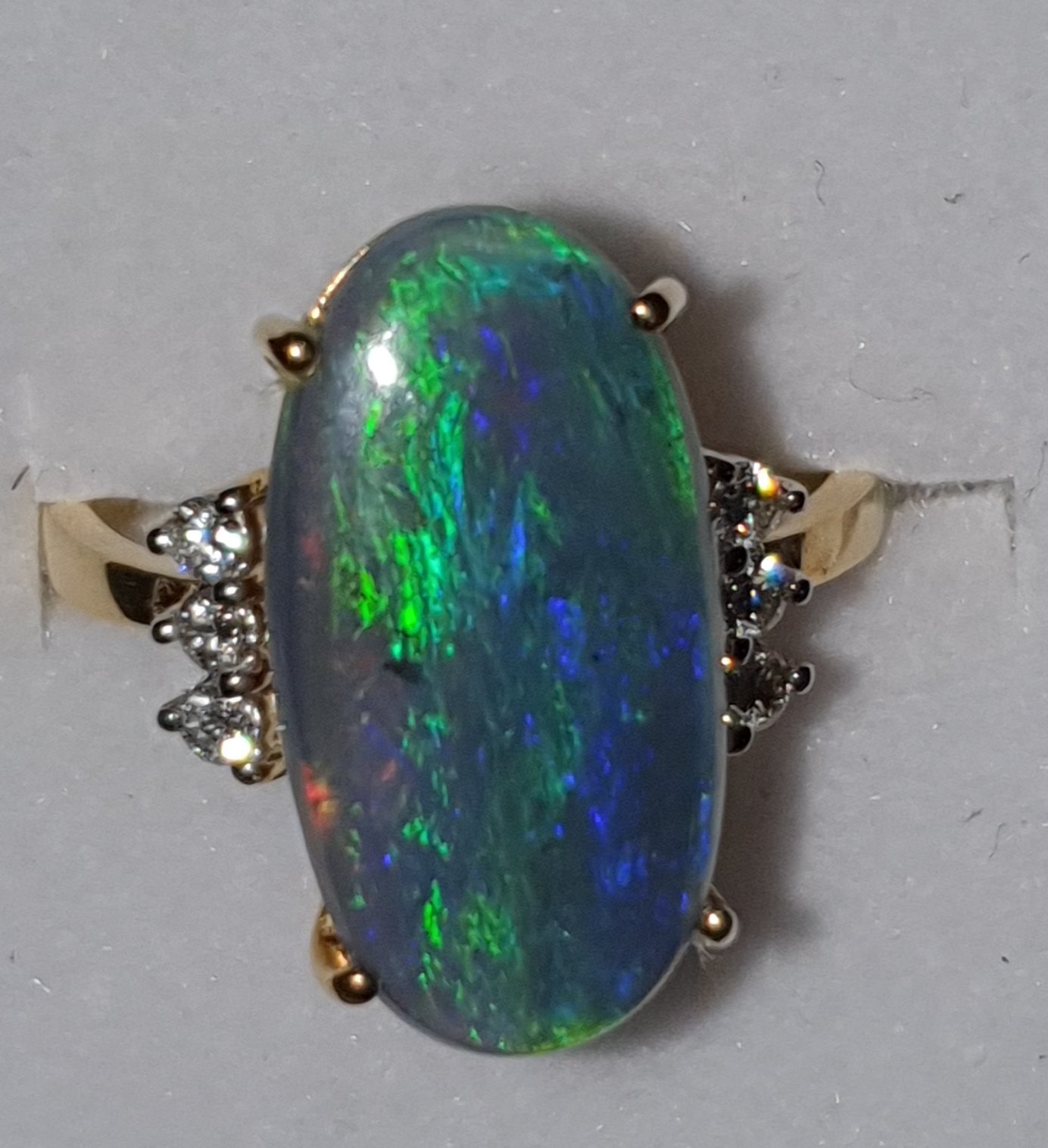 R11  Opal & Diamond Dress Ring, Featuring Semi Black Opal Cabochon Claw Set, Supported by 6 Brilliant Cut Diamonds. 9ct Yellow Gold Set