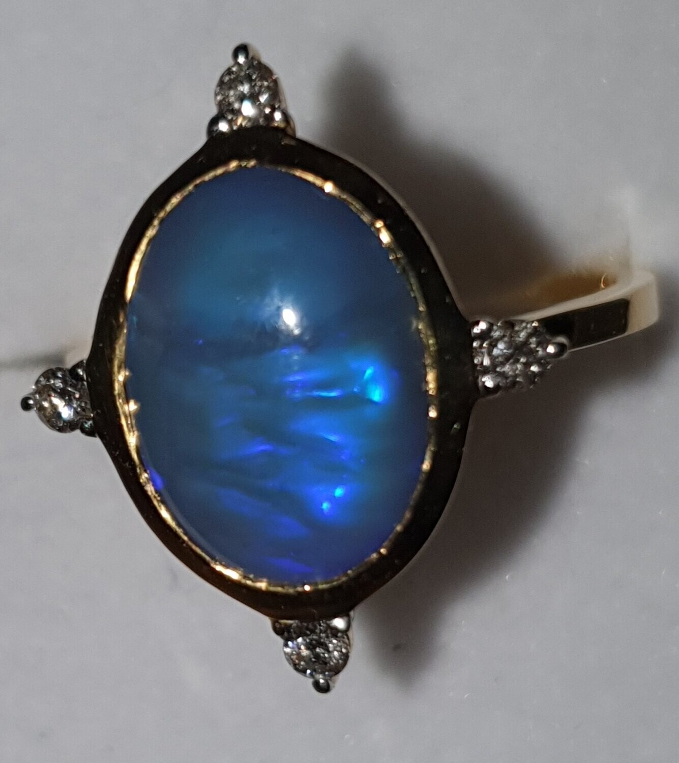 R14 Opal & Diamond Dress Ring, Featuring Oval Cut Solid Black Opal Cabochon Set With 4 Brilliant Cut Diamonds Claw Set on 9ct Yellow Gold