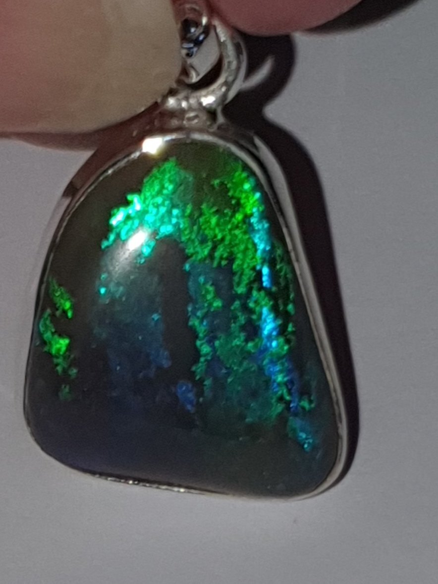 P28  Lightning Ridge Solid Black Opal Pendant Set in Sterling Silver, 15 X 17mm With Rolling Green & Purple Flashes From Black Background