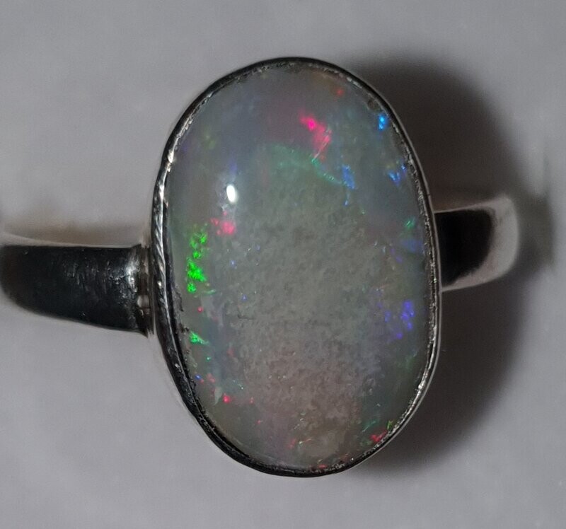 R24  Sterling Silver Set Solid Grey Base Opal, 10 X 15mm Across Face With Red, Orange, Yellow, Green, Blue & Purple Flash