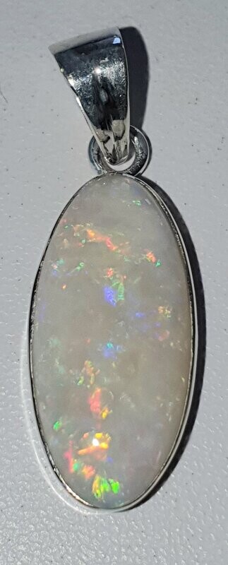 P27a Coober Pedy White Solid Opal with reds, orange, green & blue flashes
12mm across x 25mm opal size