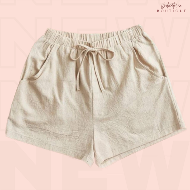 Shorts unicolor con nudo delantero