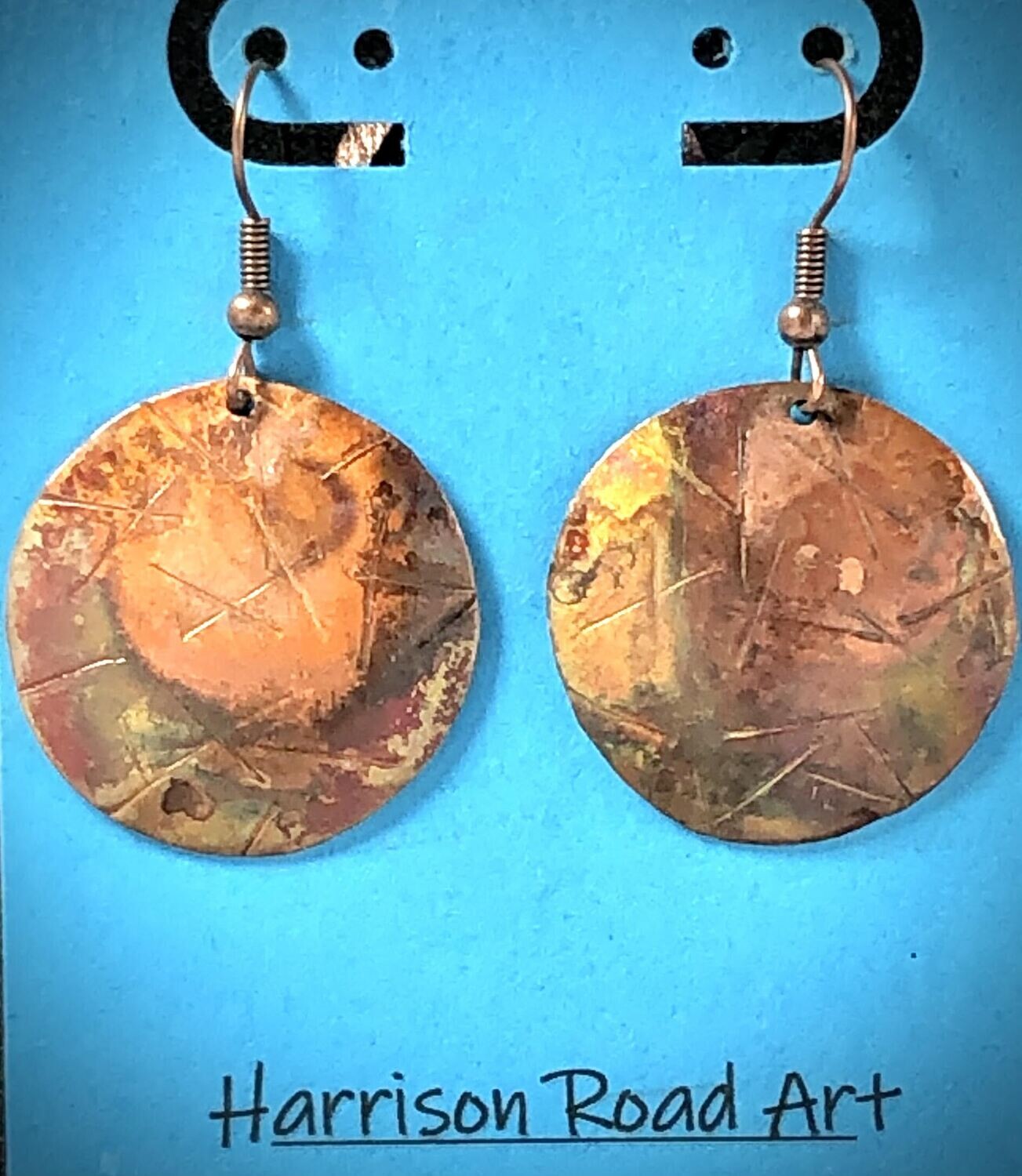 Flame Painted Copper. Stamped. Steel ear wires. ~1 inch diameter