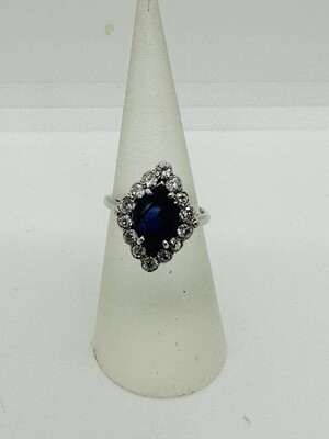 white gold Kite shape Sapphire surrounded by diamonds ring