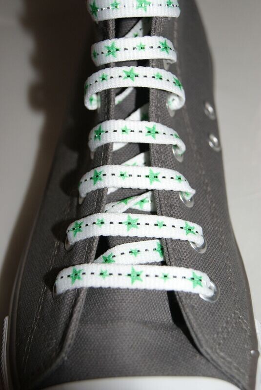 White shoelaces and neon green stars