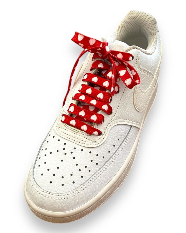 Red shoelaces with white hearts