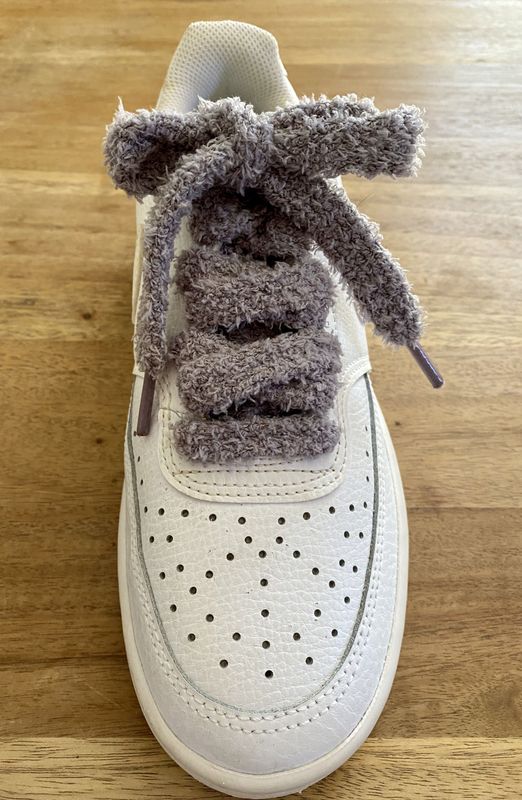 Fluffy, soft sneaker laces in an ash gray color