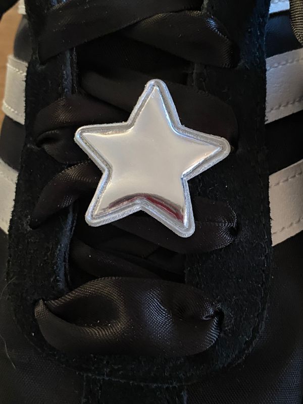 Silver-tone faux leather star shoe accessories, clip-on design.