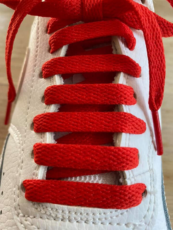 Flat red shoelaces for shoes and sneakers made from recycled material