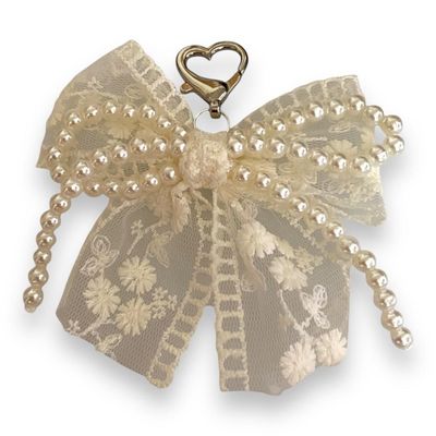 Bijoux pompon perles avec tulle brodé