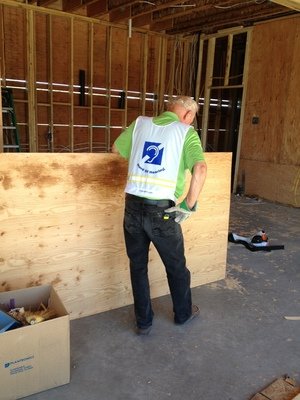 Man working in construction with plywood