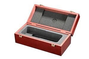 Open Neumann brown wooden box with two catches and internal foam lining with foam cut-out shaped for a particular microphone