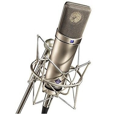 Neumann nickel coloured U87 large diaphragm microphone with purple logo name badge in a nickel coloured elastic suspension