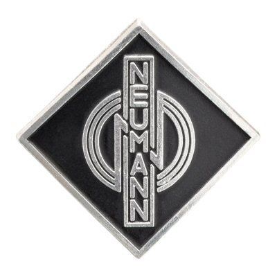 Metal alloy diamond shaped name badge Neumann 071306 with three stylised concentric rings over black on a white background