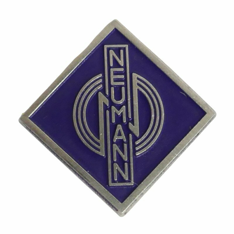 Metal diamond shape logo badge with purple background and vertical Neumann and three stylised concentric circles on white