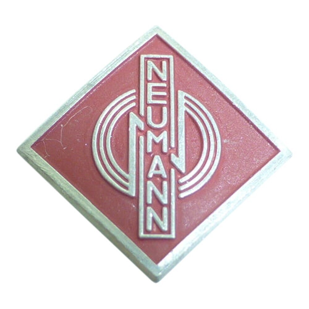 Red diamond shaped metal Logo badge in 1950s typeface Neumann with three stylized concentric circles on a white background