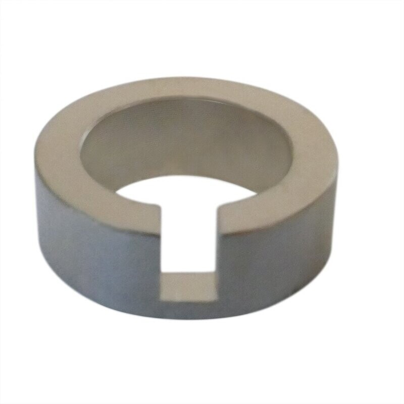 Neumann Shim Round metal bush with slotted section shown front of image on a white background   