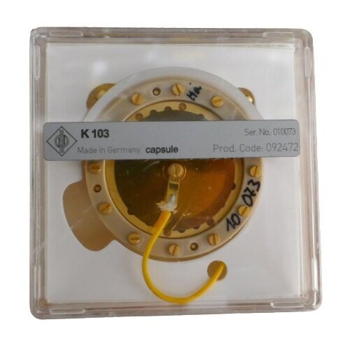 Neumann Perspex plastic case containing part 092472  gold surfaced mic capsule K103 and central yellow connection wire