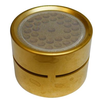 Neumann golden coloured Rollo sweet shaped mic capsule with grill on top and slitted edge on two halves on white background  