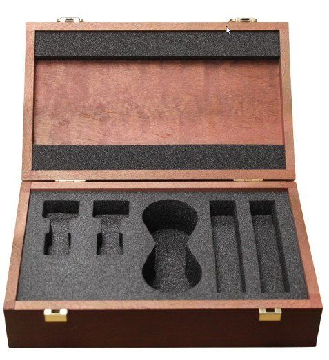 Neumann open hinged brown Wooden oblong Box with black foam cut out for KM180 microphone kit on a white background