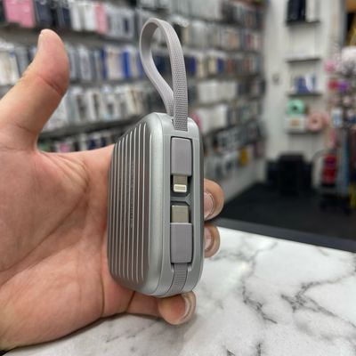 Silver trend Power Bank for Adhesive Stickers 10,000 watts, mini size, powerful, with a hanger, Type-C and Lightning charging cables, USB and Type-C ports, and a display for remaining charge.