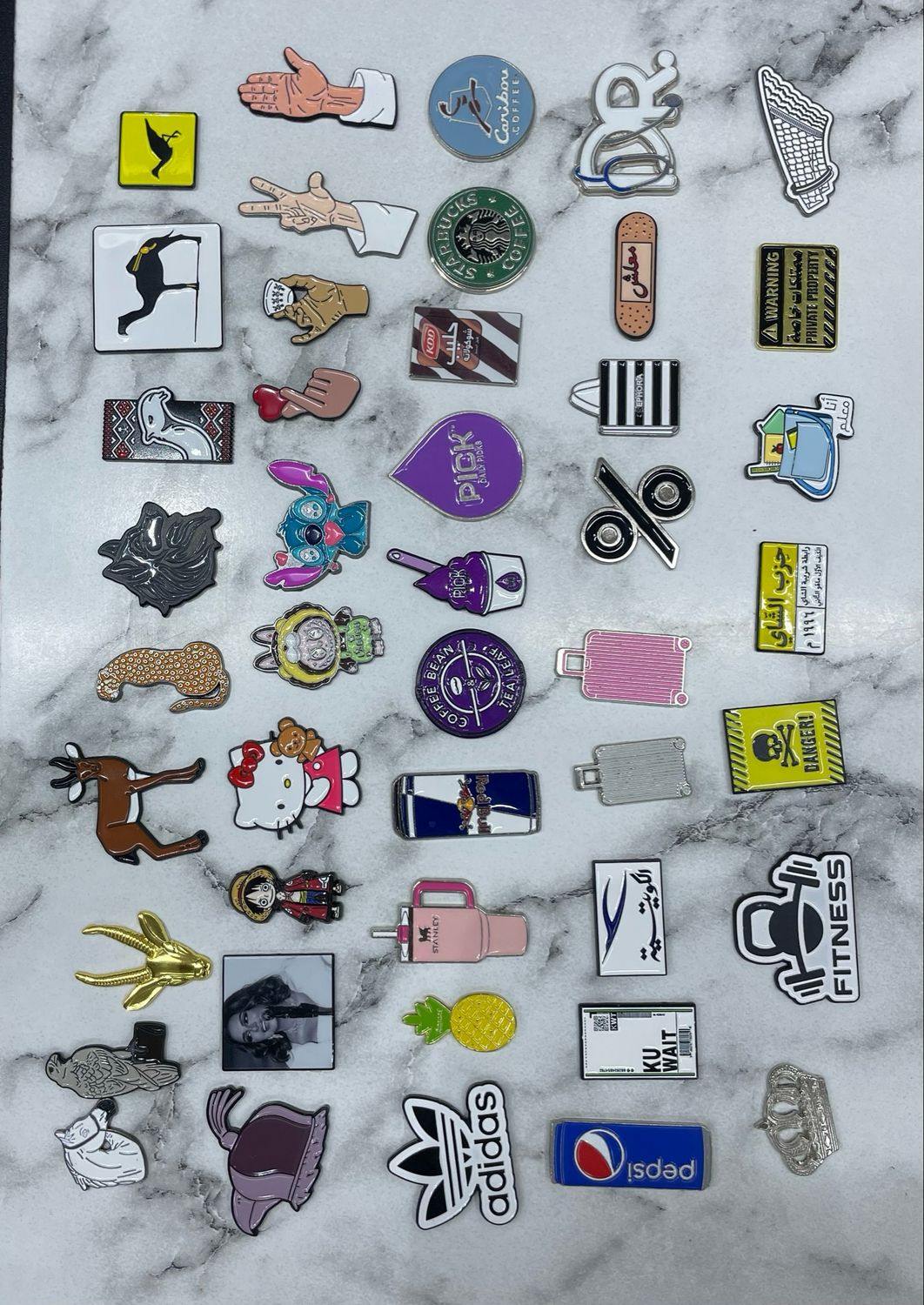 A strong, sticky metal logo that you can place on a phone or anywhere of your choice, in various shapes