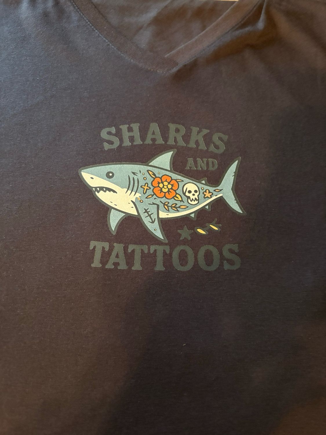 Women’s T-Shirts with an image of a Shark &amp; Tattoos and words that say “Sharks &amp; Tattoos”