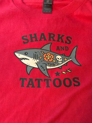 Men’s T-Shirt with image of Sharks & Tattoos with the words “Sharks & Tattoos”