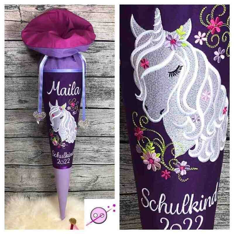 Einhorn Schultüte lila und flieder Schultüte aus Stoff mit einem gestickten Einhorn.