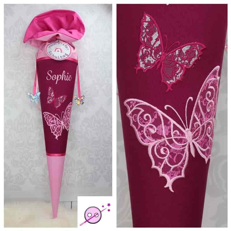 Schmetterling Schultüte Schmetterling Schultüte aus Stoff individuell mit Namen für Mädchen. Diese Zuckertüte ist bestickt mit zwei wunderschönen Schmetterkingen. In den Flügeln befindet sich Spitze. Der Hintergrund ist beere. Die Spitze und der Verschluß rosa.