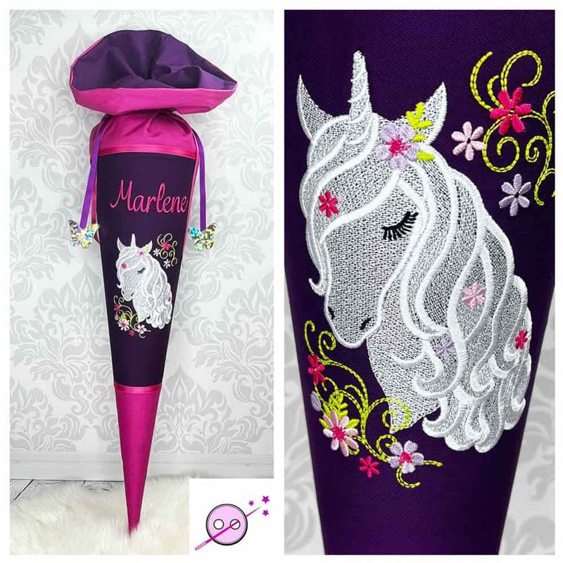 Schultüte aus Stoff mit einem weißen bestickten Einhorn.