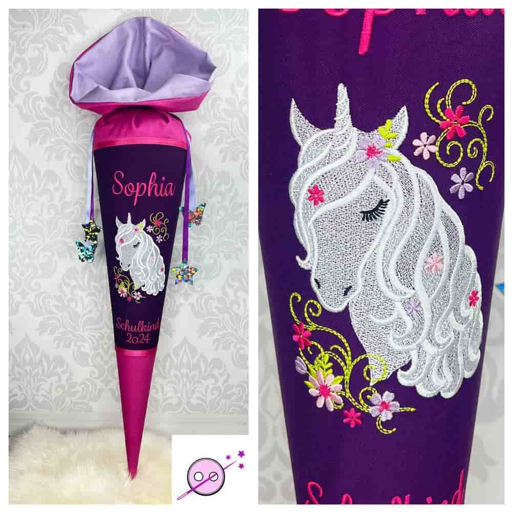 Schultüte aus Stoff mit einem gestickten weißen Einhorn in der Mitte.
