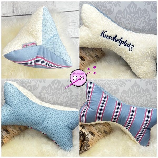 Lesekissen - Leseknochen blau und pink. Eine Seite ist aus cremfarbenen Teddystoff der mit Kuschelplatz bestickt ist, die zwei anderen Seiten haben verschiedene Muster aus blau und magenta.
