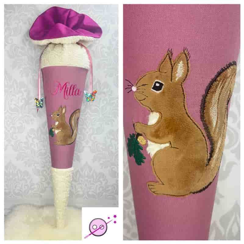 Eine Schultüte mit dickem Teddystoff in der Spitze und oben. Als Motiv ein gesticktes Eichhörnchen auf altrosa Stoff.