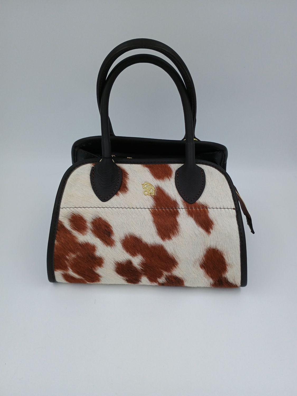 Classy Nitty handtas in leder en koehuid