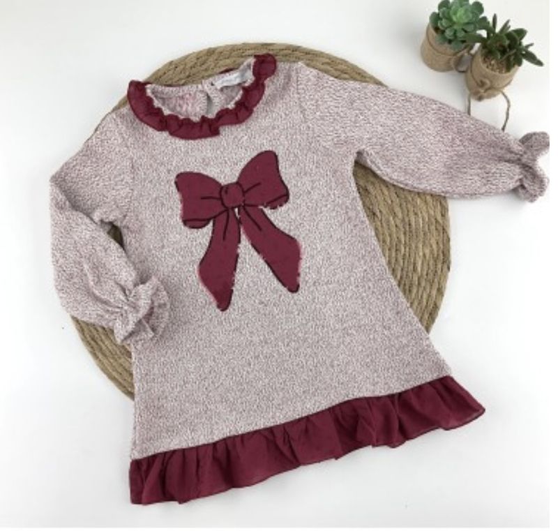 Diverchic kleed met strik