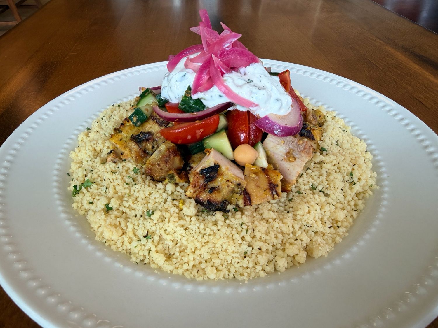 Grilled Greek Chicken Bowl with Tzatziki, Pickled Red Onions, Herb Couscous and a Greek Salad
