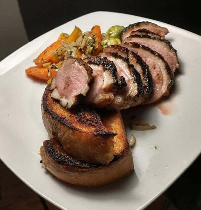 Habanero Honey Duck Breast with Roasted Carrots, Brussel Sprouts, Mini Yellow Peppers, and Pan-toasted, Honey-soaked French Bread.