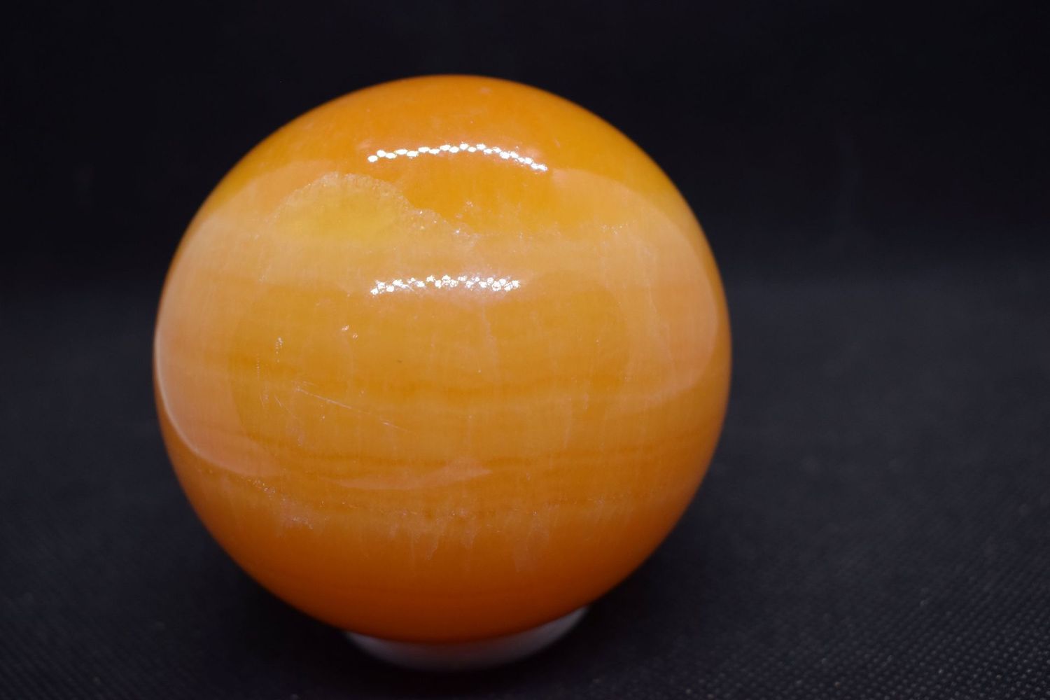 Kristallkugel: Orangencalcit