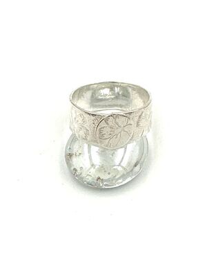 Wide, flower stamped ring