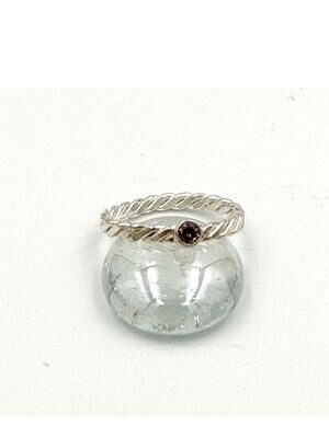Twist ring with pink cubic zirconia