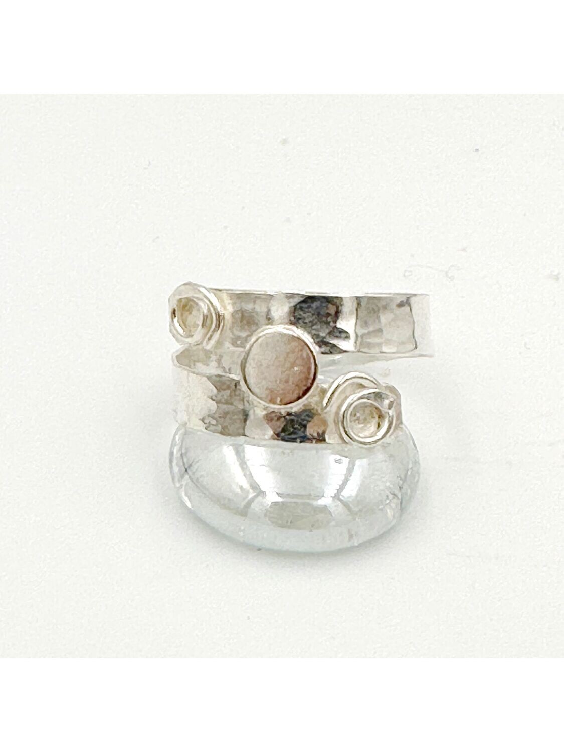 Crossover ring with circle and spiral detail