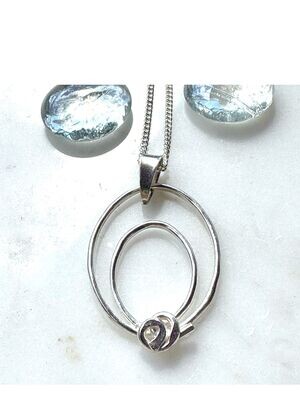 Double oval pendant with swirl detail