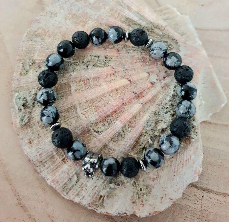 ⚪️⚫️ OBSIDIENNE NEIGE/PIERRE DE LAVE ⚫️⚪️ CALME/MOTIVATION/APAISEMENT Bracelet extensible mixte. T. 19,5cm. Perles en véritable Obsidienne neige et pierre de lave. Création artisanale. Modèle unique.