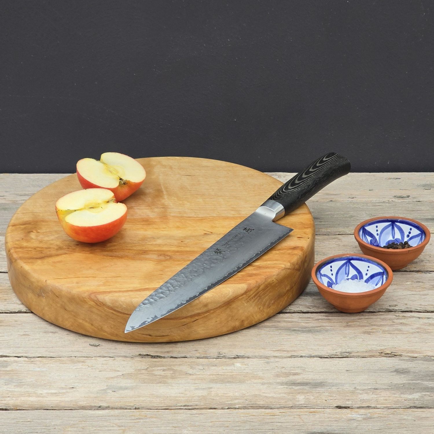 Handcrafted birch chopping board, circular and chunky, ideal for bread, cheese, or everyday kitchen use.