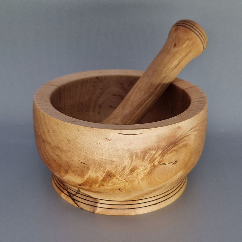Birch pestle and mortar set with smooth finish and wire-burnt rings, handcrafted for grinding herbs and spices.