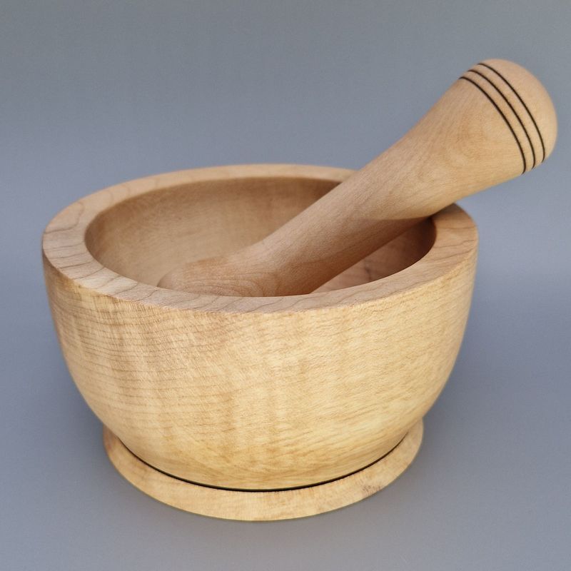 Sycamore pestle and mortar set with smooth finish and wire-burnt rings, handcrafted for grinding herbs and spices.