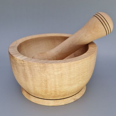 Sycamore pestle and mortar set with smooth finish and wire-burnt rings, handcrafted for grinding herbs and spices.