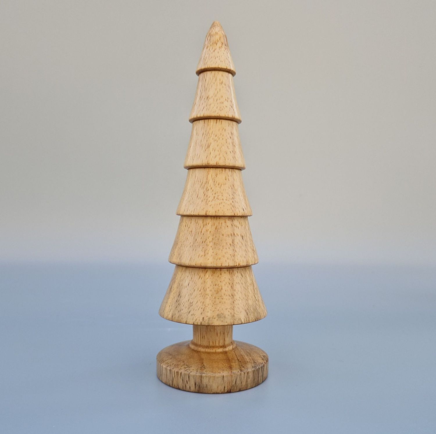 Tiered wooden tree with six stacked segments and smooth base. Finished with oil and wax to highlight the natural grain
